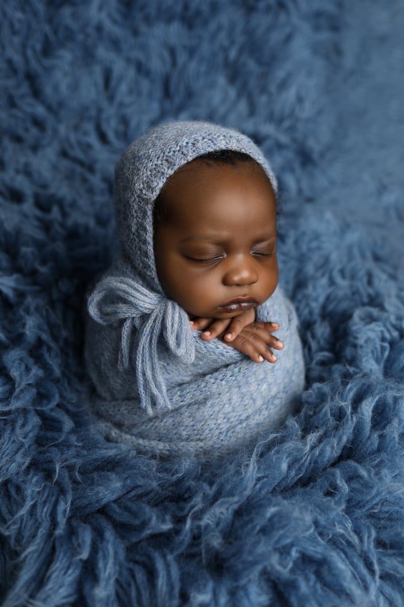 baby on a blue soft blanket