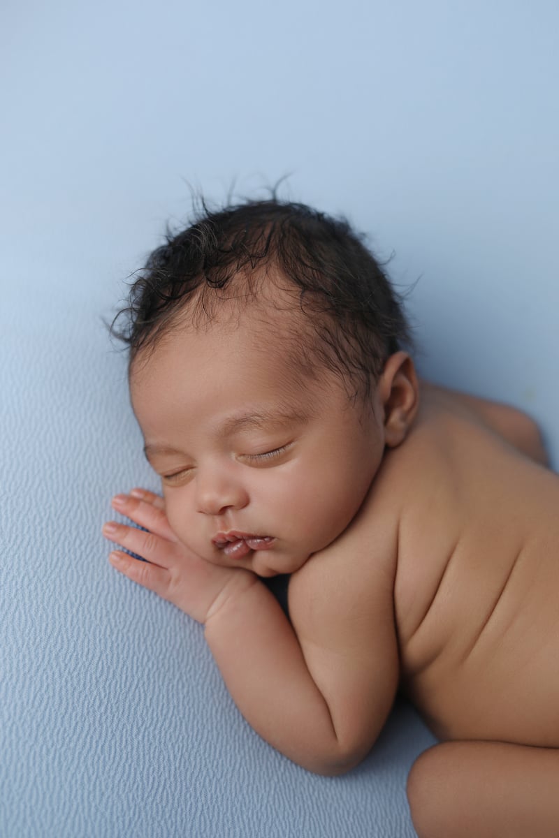 sleeping baby on a blue background