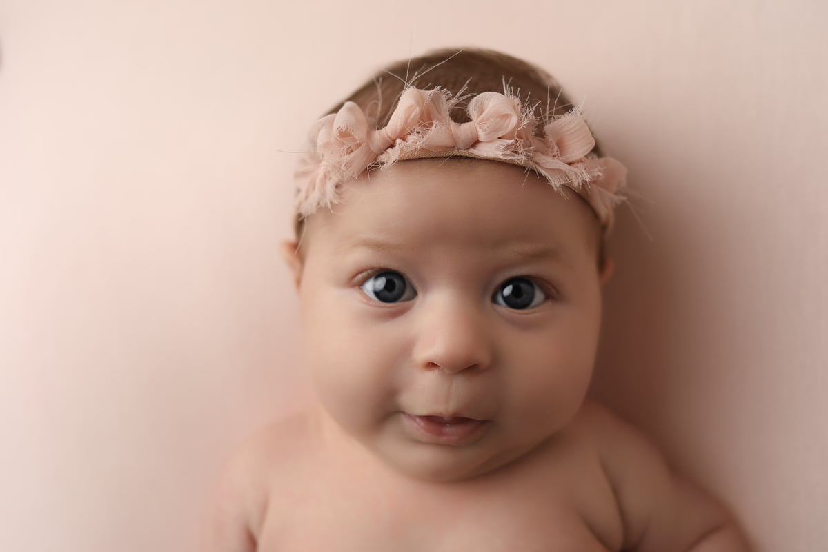 close up on baby in a photoshoot for baby art studios