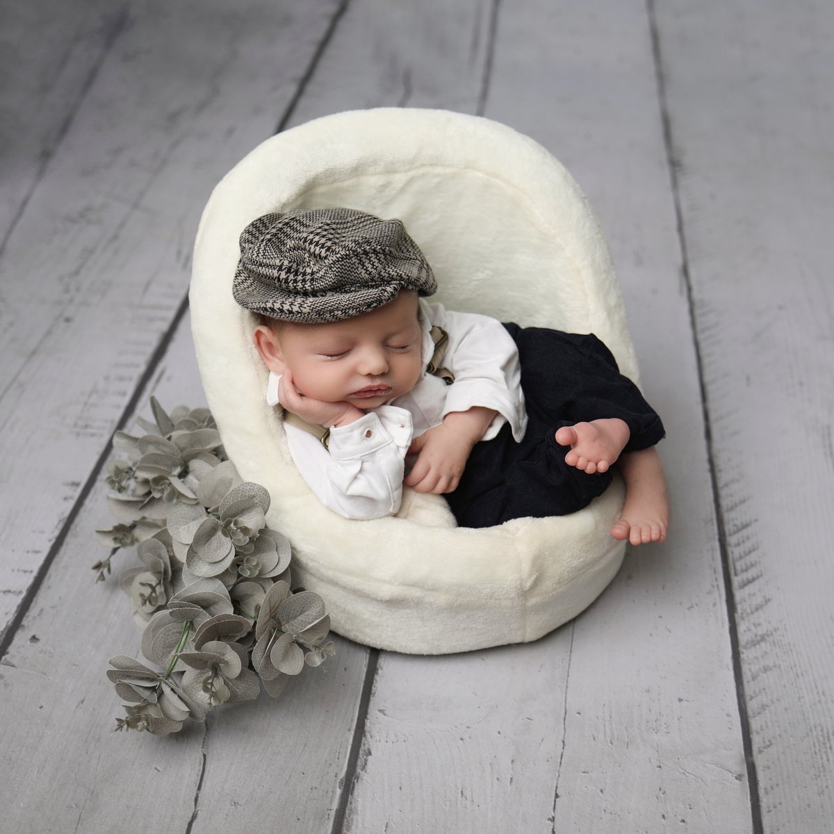 baby posing in small soft chair